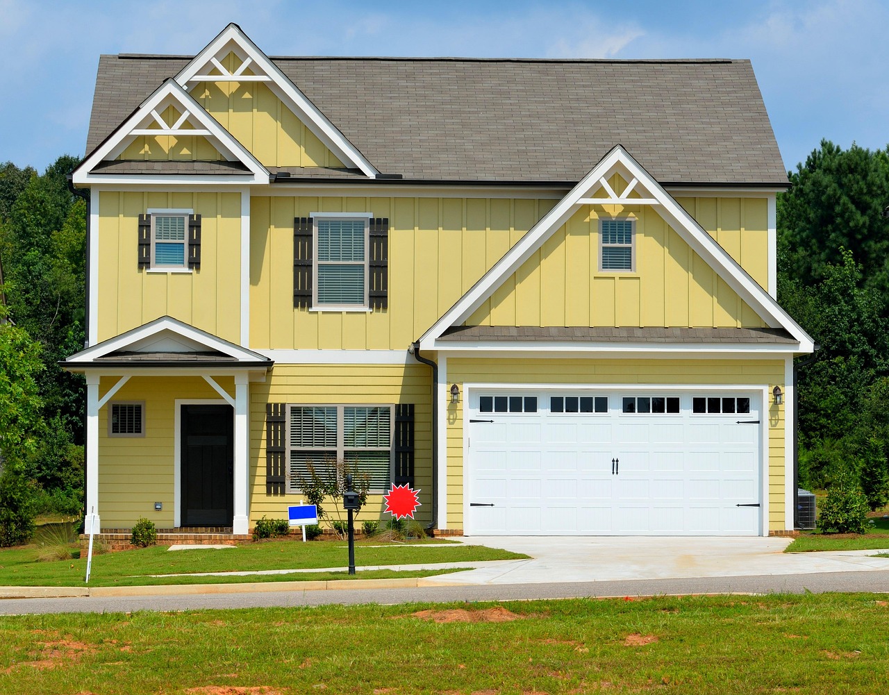 Residential home with a driveway and garage