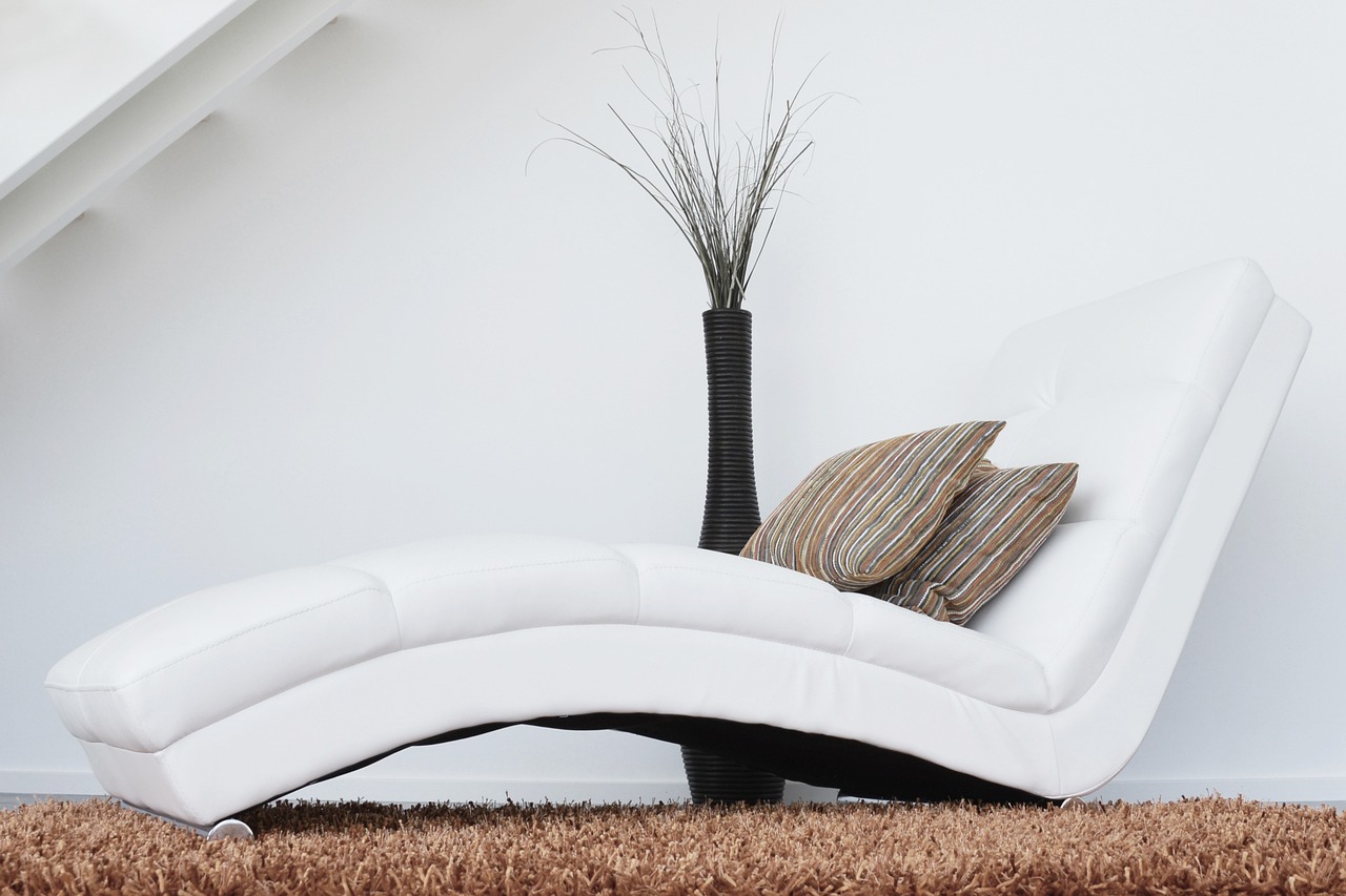 Upholstered sofa with fabric cushions
